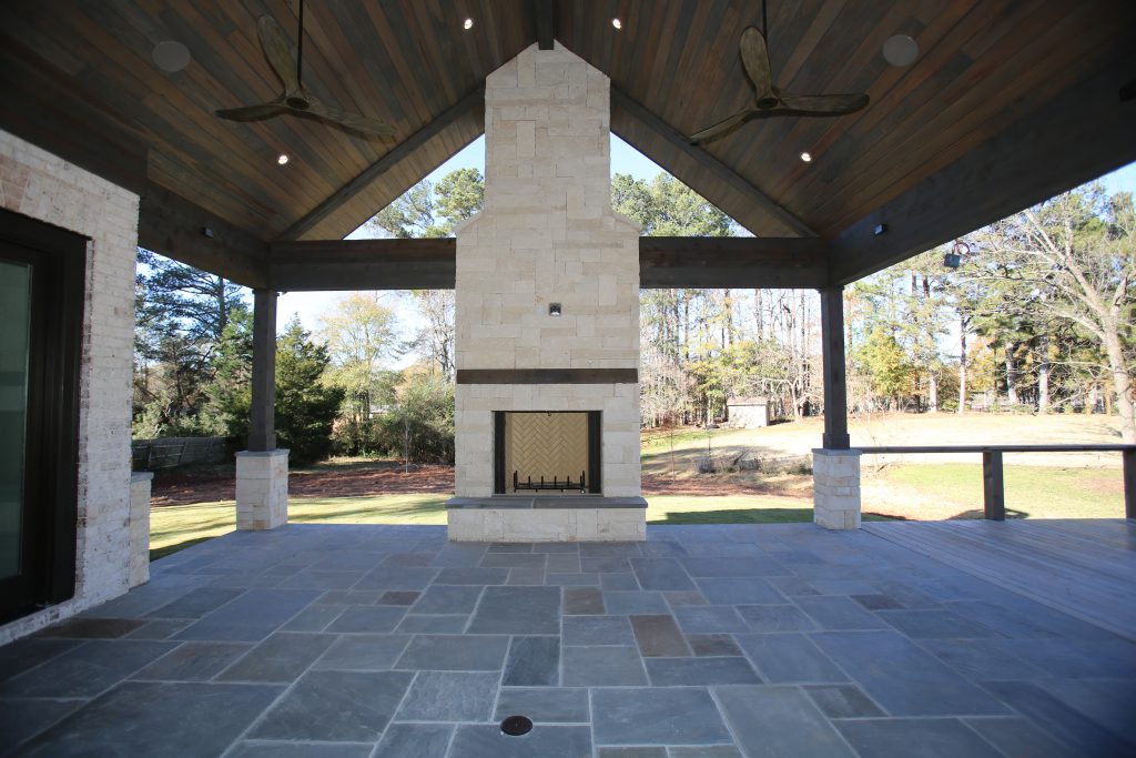 a Norm Hughes deck renovation with fireplace