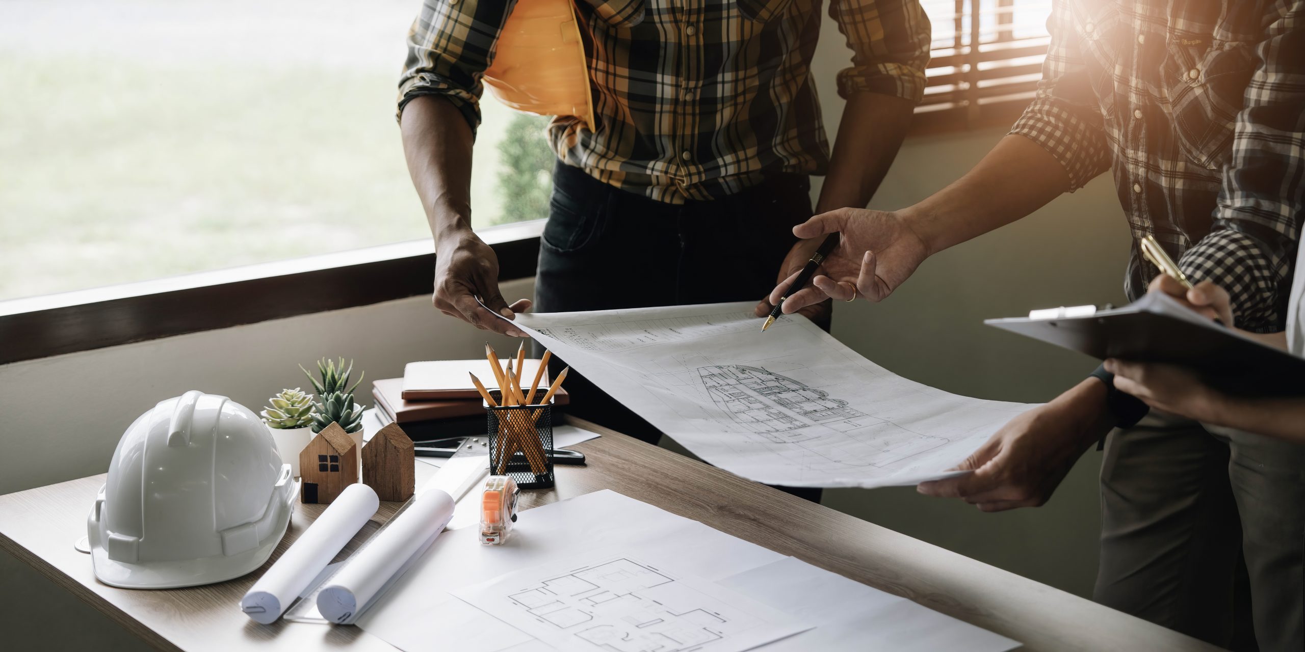 construction team planning home remodel