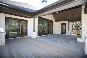 a custom deck built with gray wood planks