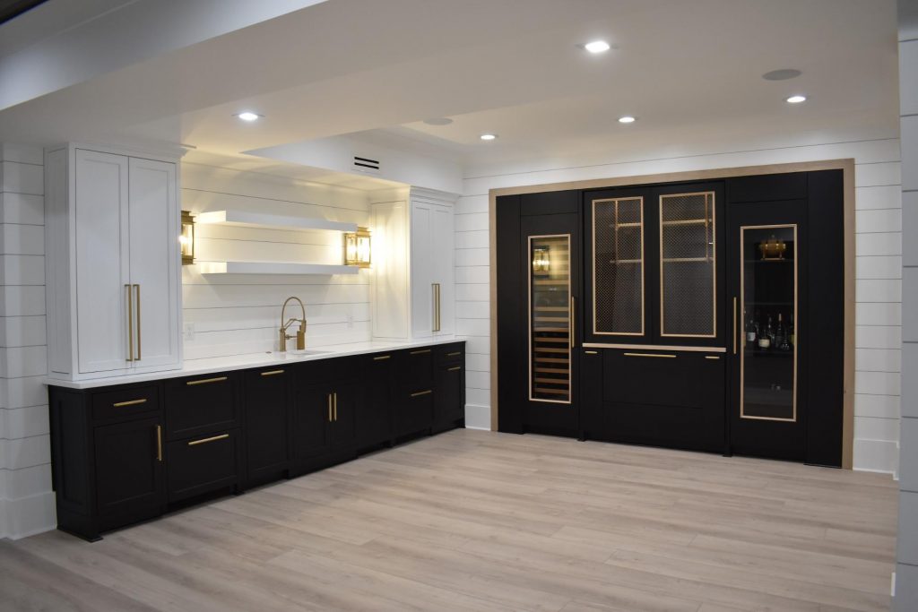 Home remodel in basement with built-in wine storage and wet bar
