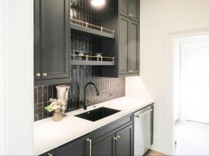 Custom walk-in pantry with built-in cabinets and shelving