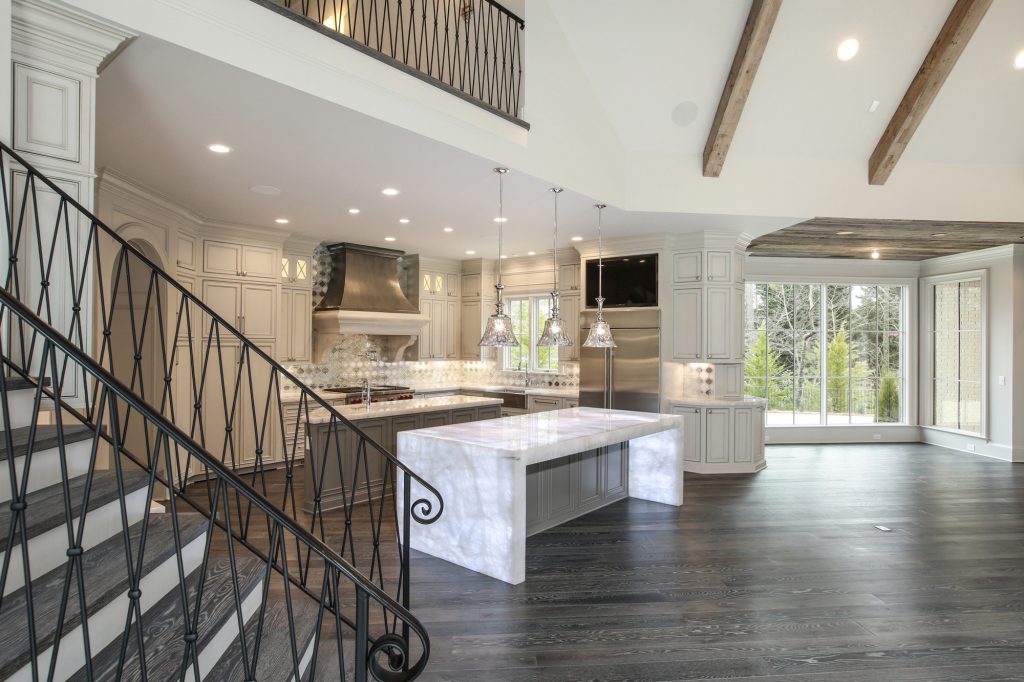 Luxury kitchen renovation with marble countertops and custom cabinetry by Norm Hughes Homes