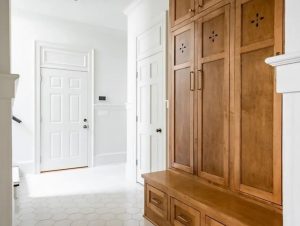 Mudroom with custom storage wall with built-in cabinetry