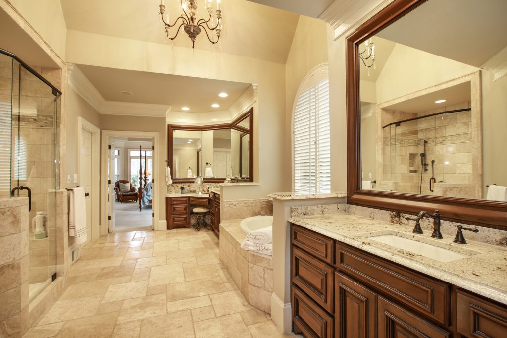 Luxury bathroom remodel with extended vanity and walk-in glass shower