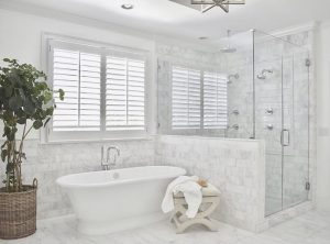 Spa-style bathroom remodel with freestanding tub and glass walk-in shower