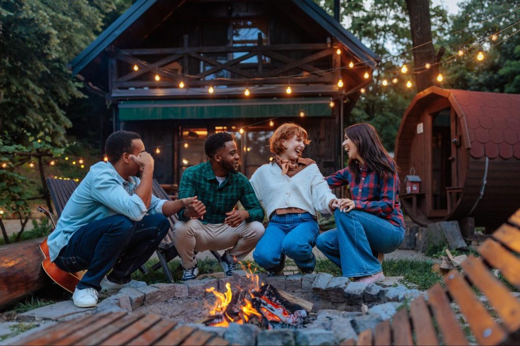 A group of friends enjoying a wood-burning fire pit
©bbernard